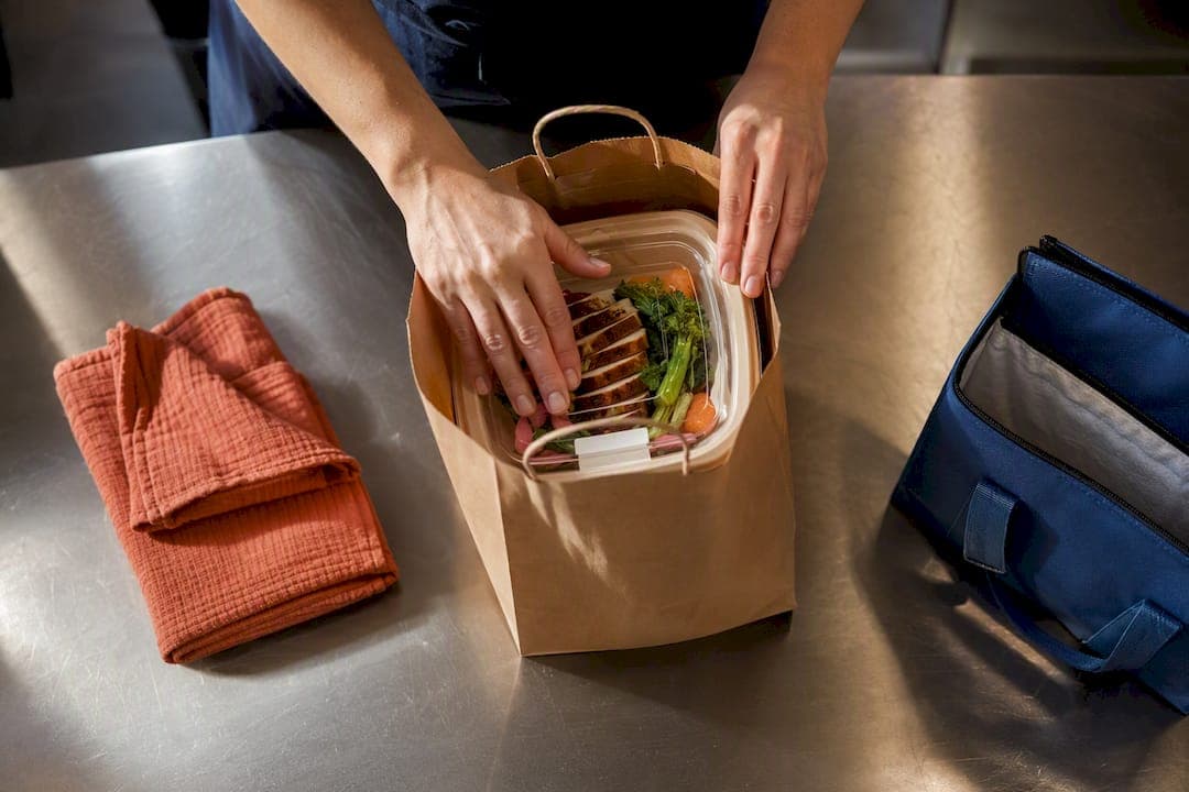 Restaurant worker packaging takeaway meal